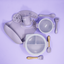Lulushop 9-piece baby feeding set in Lavander Mist, featuring silicone suction plate, bowl, bib, cup, and utensils.