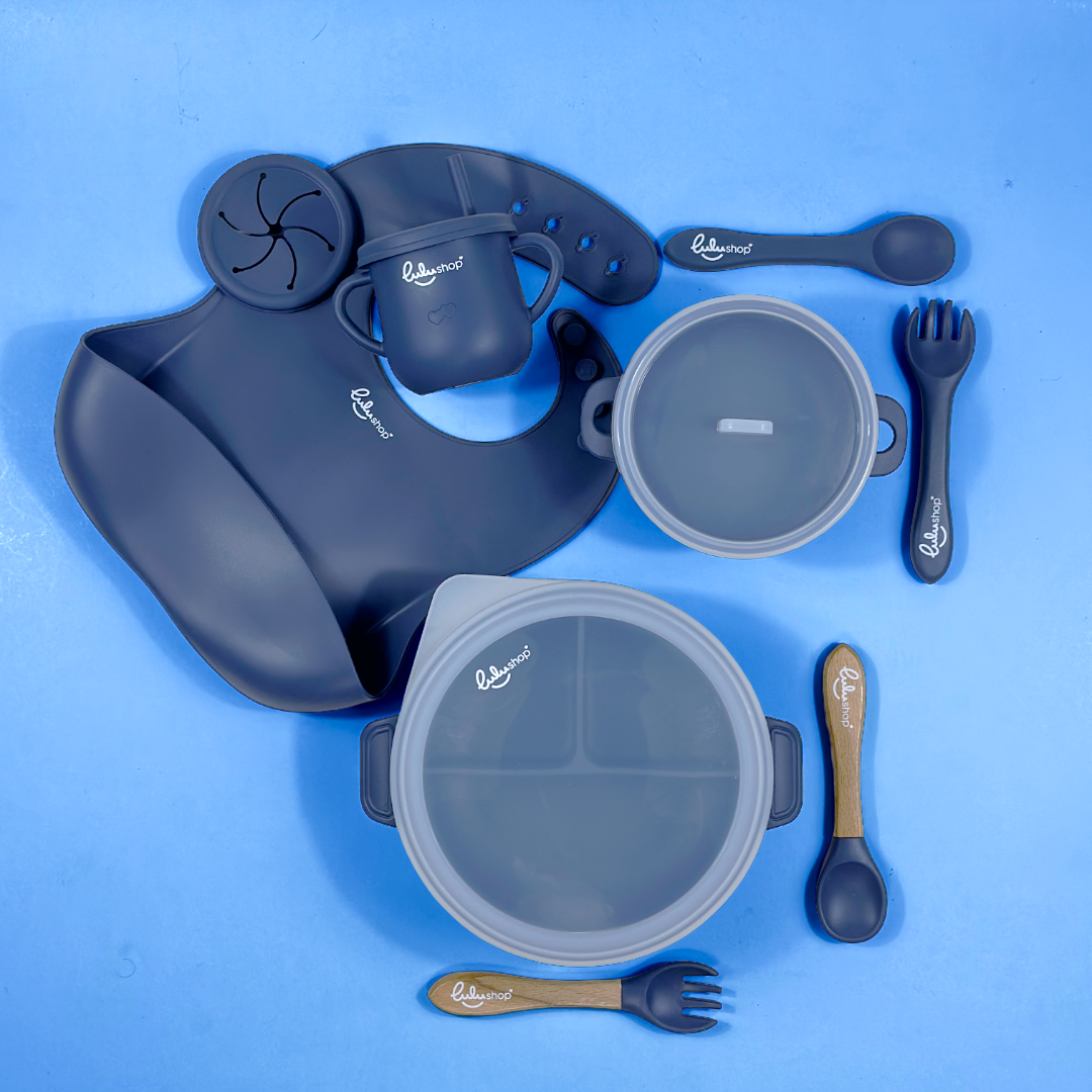 Lulushop 9-piece baby feeding set in Marble Blue, featuring silicone suction plate, bowl, bib, cup, and utensils.