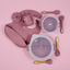 Lulushop 9-piece baby feeding set in Pink Daisy, featuring silicone suction plate, bowl, bib, cup, and utensils.